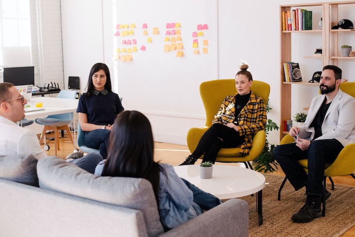 People in meeting room. Training for companies where relationships in the company and success factors are discussed.